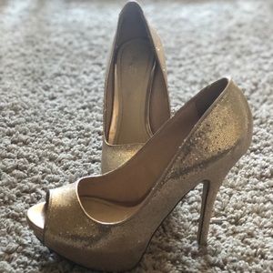 Gold peep toe heels.